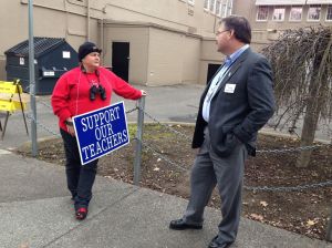 Medford Superintendent Phil Long talks with a striking teacher. From the Medford School District 549C Facebook Page